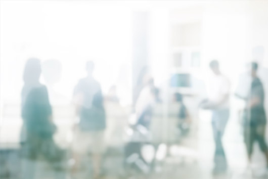 A photo of people in a work setting, as a metaphor for stakeholders interacting with Oakford Group property operations