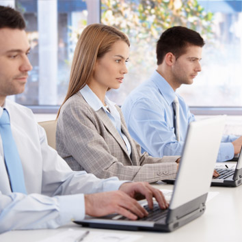 A colour picture of stakeholders working in a business setting symbolising the operations focus of Oakford Group