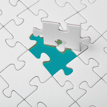 A colour picture of a jigsaw, with the final piece completing the puzzle as a metaphor for the tailored services enabling the streamlined operations of Oakford Group