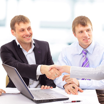 A colour picture of business stakeholders interacting, symbolising the operations of Oakford Group